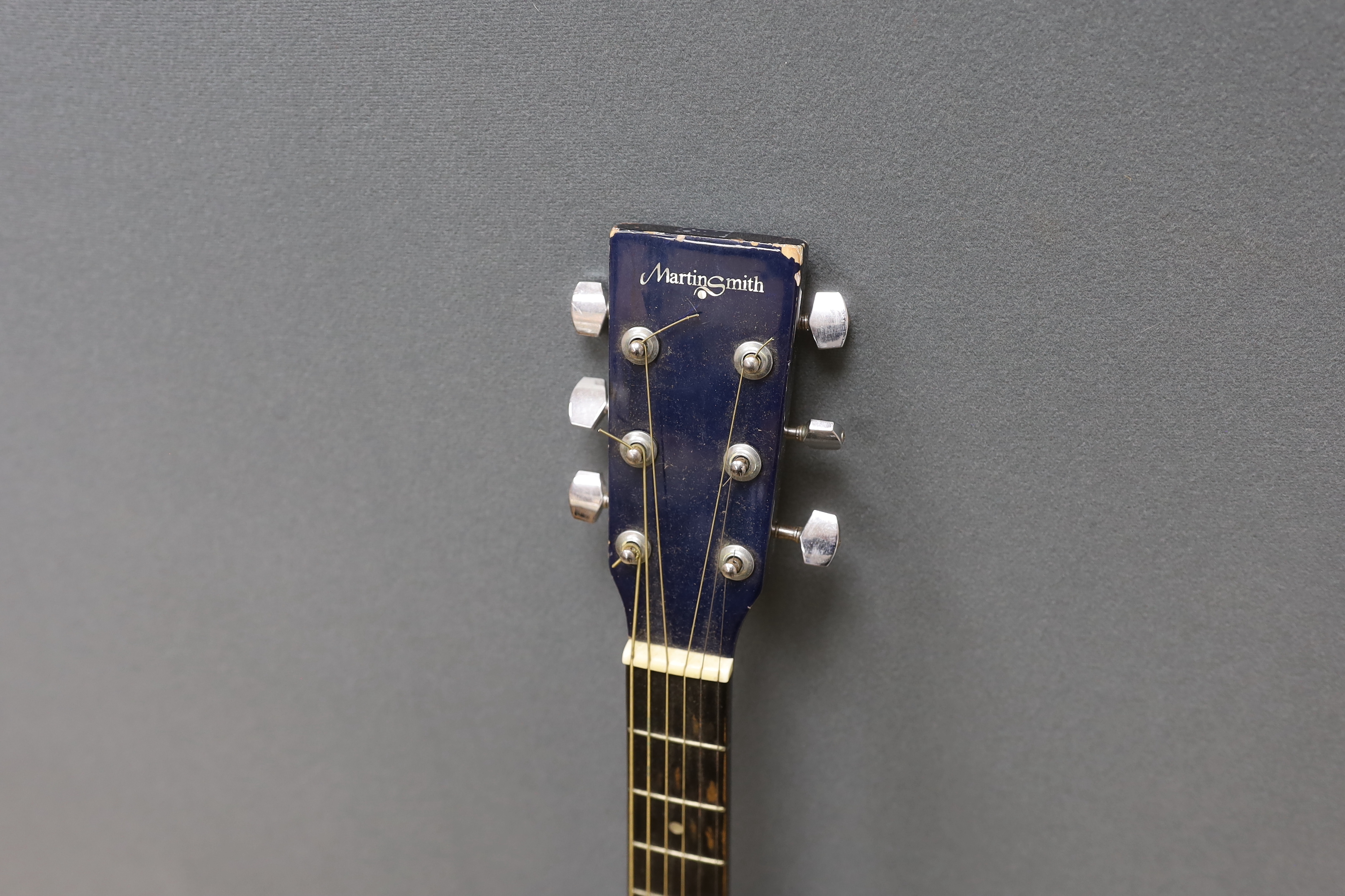 A Martin Smith electro-acoustic guitar in a Ritter soft case